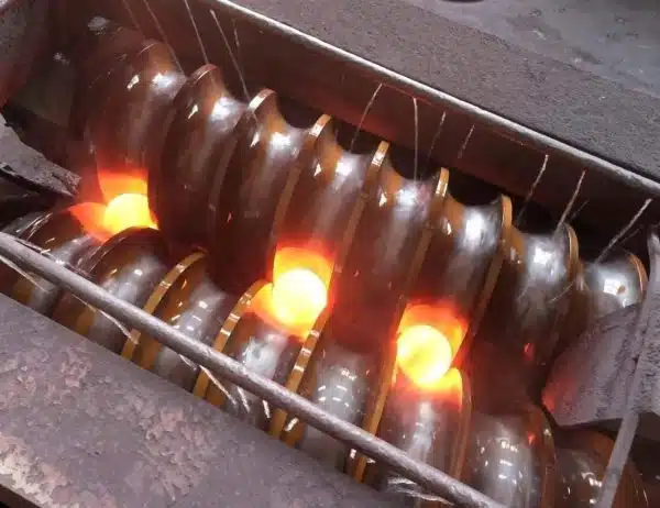 Hot rolled steel balls forming in rolling mill at Shandong Gangyan Grinding Ball Co., Ltd.