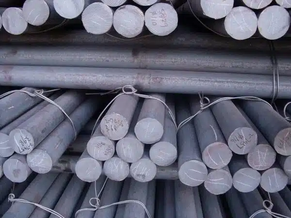 Bundles of grinding steel rods stacked together, commonly used in rod mills for ore processing, cement manufacturing, and mineral grinding.