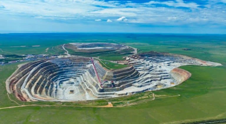 Aerial view of a mining site where grinding balls play a key role in material processing.