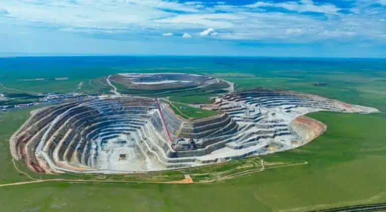 Aerial view of a mining site where grinding balls play a key role in material processing.
