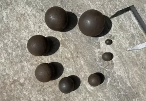 Various sizes of rolling balls used in grinding processes.