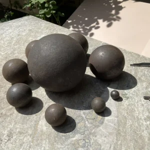 Forged high carbon steel grinding balls for mining and milling.